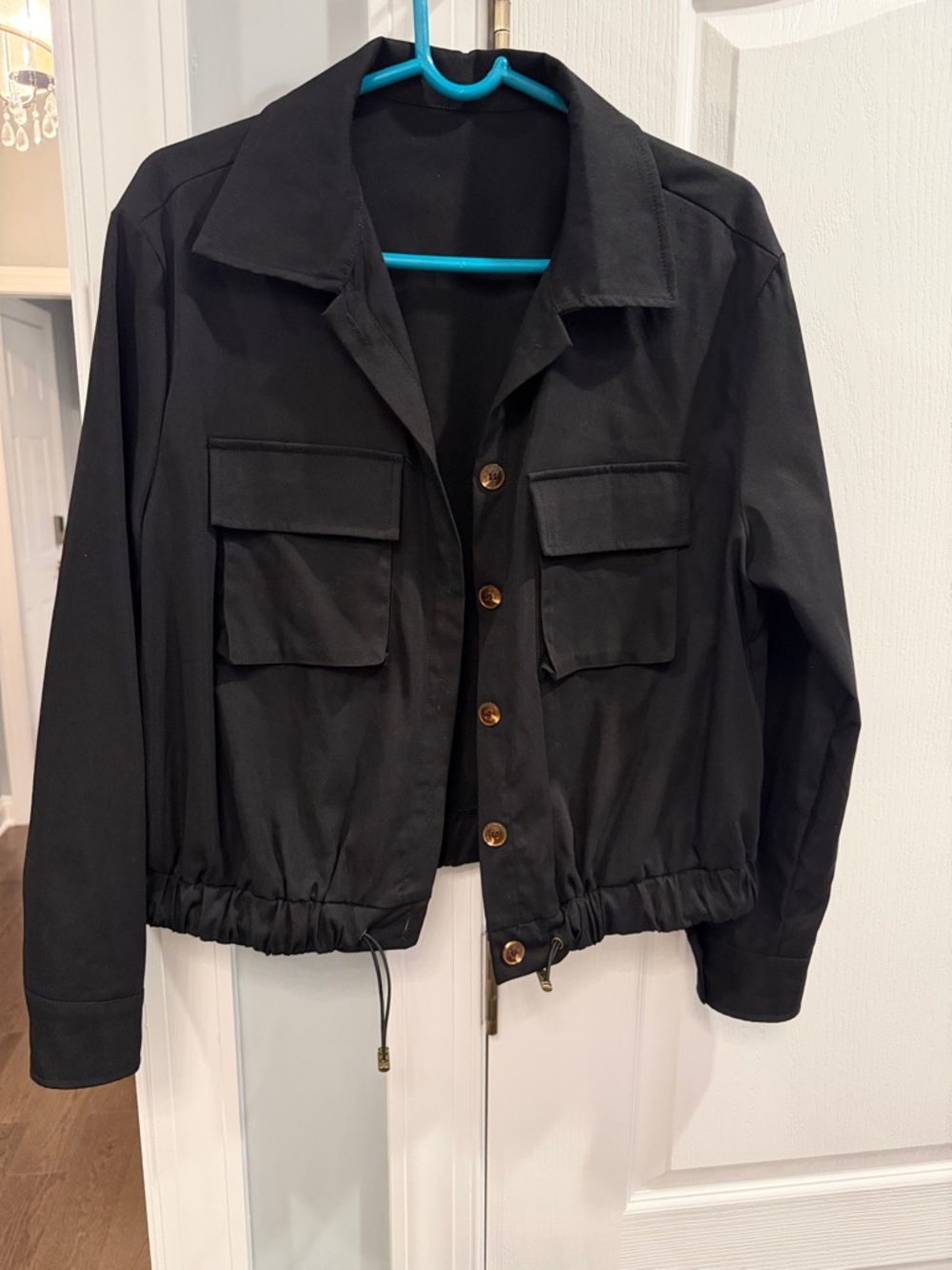 Black light jacket size medium, cute pockets; buttons; nice fit